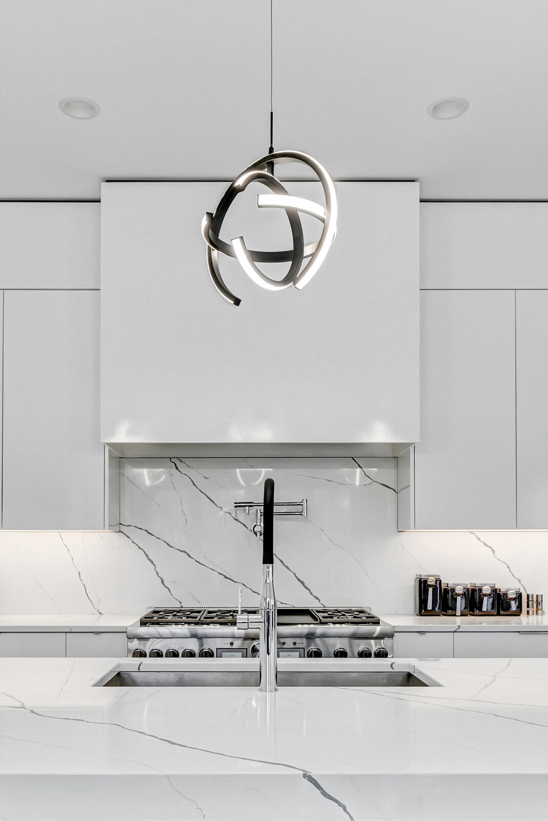 Waterfall marble and hand-finished cabinetry